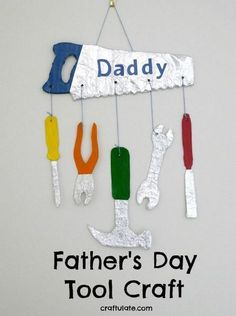 a father's day tool craft hanging on a wall