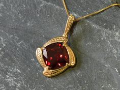 Gold Ruby Pendant set with a Created Ruby in a top quality, perfect clarity & stunning red color, at 12x12mm, weighting 7 Carats.Vintage Pendant design made of Gold Vermeil ☞ thickest 18k Gold Plating on top of Solid 925 Sterling Silver ☞ made to last.Free Vermeil Chain with every Pendant order, 18 inch Silver chain (46 cm) ✓Matching Ring & Matching Earrings - please ask me⌛Last Pendant left ⌛  Details : ♥ Each item comes in a cute GIFT BOX ✓ ♥ GUARANTEE on the materials ✓♥ Created Ruby Classic Red Ruby Jewelry, Classic Red Jewelry As A Gift, Classic Red Gemstone Jewelry, Classic Red Pendant Necklace, Classic Red Birthstone Jewelry, Elegant Red Birthstone Jewelry, Red Square Pendant Gemstone Jewelry, Red Gemstone Square Pendant Jewelry, Red Gemstone Jewelry With Square Pendant