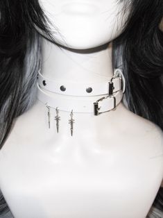 This double-wrap choker is a statement piece that adds an edgy flair to any outfit. The choker features stud embellishments and a distinctive sword pendant, creating a bold and unique look.  Please note that the price includes one choker only. Gothic Piercings, Kawaii Leg Warmers, Punk Choker, Punk Tops, Pastel Punk, Gothic Bag, Fashion Corset, Heart Shaped Bag, Steampunk Fashion Male