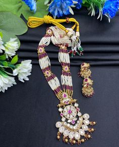 Your traditional attire with this exquisite Heer Rajwadi Kundan long Meenakari Necklace with Jhumka Earring set, featuring a stunning combination of gold and pink hues. Perfect for special occasions, this set exudes elegance and sophistication, making it a must-have addition to your jewelry collection. Style & Look: Elevate your style with the Heer Rajwadi Kundan long Meenakari necklace, beautifully complemented by Jhumka earrings. This exquisite set combines the regal allure of Rajwadi design w Luxury Festive Meenakari Necklaces, Gold Kundan Necklace With Meenakari In Traditional Drape, Diwali Temple Jewelry Sets With Meenakari, Diwali Meenakari Temple Jewelry Sets, Pink Temple Jewelry Necklace With Latkans, Traditional Jewelry Sets For Eid Celebration, Multicolor Kundan Necklace With Zari Work, Traditional Multicolor Kundan Necklace With Zari Work, Eid Temple Jewelry Sets With Zari Work