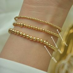 ** BUY ANY THREE (3) ITEMS AND GET 20%OFF ON YOUR ENTIRE PURCHASE ** Gold Bead Bracelet, Beaded Bracelet, Gold Bracelet, 18K Gold Filled Bead Bracelet, Stacking Bracelet 2mm 3mm 4mm, Dainty Bracelet Classic 18k gold-filled bead bracelet is a perfect addition to a dainty stack this spring/summer season. The beads are strung on a premium stretch cord. SOLD BY ONE BRACELET ITEMS DETAILS: Water Resistant -Nickel-free - Allergy-free - Hypoallergenic - 18K gold-filled bead bracelets - round bead size Minimalist Hypoallergenic Beaded Round Bracelets, Minimalist Hypoallergenic Round Beaded Bracelets, Minimalist Hypoallergenic Beaded Bracelet, Minimalist Hypoallergenic Round Bead Bracelets, Flexible Bracelets With Tiny Beads As A Gift, Minimalist Stackable Bracelets With Round Beads, Minimalist Beaded Bracelets With Tiny Beads, Minimalist Bracelets With Tiny Beads, Minimalist Round Bracelet With Tiny Beads