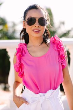 Introducing the Do Your Best Ruffled Blouse - the perfect addition to your summer wardrobe! With its ultra-feminine pink hue and ruffled detailing, this comfy-cute tank will have you looking sweet and chic! This blouse features a scoop neckline, ruffled sleeves, and a button keyhole back.  Material has no amount of stretch.Cindy is wearing the small. Feminine Summer Blouse With Ruffle Sleeves, Summer Feminine Blouse With Ruffle Sleeves, Summer Ruffle Blouse For Brunch, Summer Blouse With Ruffled Straps For Brunch, Summer Brunch Blouse With Ruffles, Feminine Beach Blouse With Ruffles, Feminine Ruffled Blouse For The Beach, Feminine Summer Tank Top With Ruffle Hem, Flirty Pink Summer Blouse