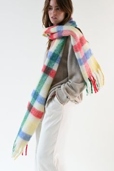 The Leah Scarf is our oversized, ultra soft blanket scarf with a multicolored plaid pattern and loose fringe ends. Designed for layering and ideal for cold weather, wrap the Leah Scarf around once or twice for a luxe, blanketed look. Oversized scarf Multicolored plaid pattern Hues of red, yellow, green, and blue Loose twisted fringe ends Soft, polyester fleece blend 11.6 inches x 90.5 inches Accessories are final sale. Your order will ship from our warehouse in FL, USA. Multicolor Fringed Scarves For Fall, Multicolor Fringe Scarves For Fall, Oversized Blanket, Oversized Scarf, Blanket Scarf, Soft Blankets, Plaid Pattern, Cold Weather, Plaid