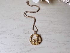 This gorgeous gold deer pendant necklace is such a classic and perfect for autumn. This vintage 1970s wreath necklace is pretty on its own or perfect for layering. Featuring a gold leaf pendant in a wreath shape with a beautifully detailed deer. Pendant is a nice solid weight, on gold small link chain. In great vintage condition, no flaws to note.  Dimensions:  15" long. leaf pendant is 1.5" ► Shop more of my necklaces here: http://etsy.me/GSHm8k ► Explore other vintage treasures: http://etsy.me Deer Pendant, Wreath Necklace, Deer Necklace, Gold Deer, Gold Leaf Pendant, Gold Wreath, Necklace Layering, Layering Necklace, Leaf Pendant