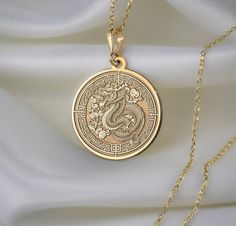 🐉 Step into the enchanting realm of Chinese New Year with our mesmerizing dragon necklace! 🎉 Crafted with meticulous attention to detail, this exquisite piece is a vibrant celebration of tradition, strength, and auspicious beginnings. Imagine the majestic dragon, intricately designed with shimmering scales ✨ and fierce claws, symbolizing power and resilience. With each wear, you'll embody the spirit of this mythical creature, carrying with you the energy of the Lunar New Year. 🌟 * Gender : Male / Female * Material Options : Silver, Gold Plated, Rose Gold, 14K Solid Gold * Thickness of Silver Pendant: 1.0 mm * Thickness of Gold Pendant: 0.8 mm * The Gold Plated and The Rose Gold Plated options are applied to 925 Sterling Silver with solution that contains 14K Gold. * There are several op Luxury Gold Necklaces With Dragon Design, Majestic Dragon, Gold Dragon, Dragon Necklace, Mythical Creature, Dragon Pendant, Necklace Personalized, Gold Coins, The Rose