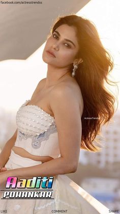 an image of a beautiful woman in white dress posing for a magazine cover photo shoot