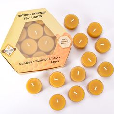 beeswax tea lights in a box on a white surface