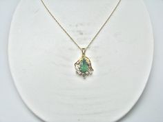 "For Sale: (1) H280 Stunning 14k Yellow Gold Emerald Necklace with Multiple Diamonds PLEASE READ ENTIRE DESCRIPTION BEFORE PURCHASING Pre-owned item. This is beautiful 14k yellow gold necklace featuring pear shaped Emerald in the center with multiple diamonds of different shape around it. No visible flaws, just some scratches please see pictures for details. Sold as is, as seen on pictures. There are earrings available that go with this necklace, and those earrings sold separately. Specifics: * 14k Gold Green Necklace With Diamond Accents, Green 14k Gold Necklace With Diamond Accents, Formal Pear-shaped Emerald Necklace In Fine Jewelry Style, Formal Pear-shaped Gemstone Necklaces, Formal Pear-shaped Emerald Necklace Fine Jewelry, Formal Pear-shaped Gemstone Necklace, Formal Pear-shaped Emerald Necklace, Exquisite May Birthstone Necklaces For Formal Occasions, Formal Teardrop Necklace With May Birthstone