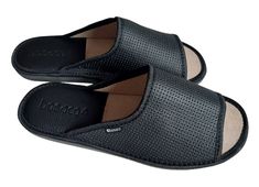 Men home slippers made of natural leather in black. These open-toe slip on sandals allow your feet to breathe freely and provide maximum comfort, and they also feature unique eyelets on the upper for an elegant look. Additionally, in the heel area there is a leather insert with foam, which guarantees comfort and stability, preventing slipping and acting as a shock absorber, protecting the feet against injuries while walking. The sole is made of EVA foam, which increases the comfort of wearing th Black Leather Slippers With Removable Insole, Black Open Toe Slippers With Leather Sole, Black Leather Slide Slippers, Black Open Toe Slippers With Leather Footbed, Black Leather Lined Mules For Summer, Summer Black Mules With Leather Lining, Black Leather Sole Slide Slippers, Black Open Toe Slides With Leather Footbed, Black Slide Mules With Removable Insole