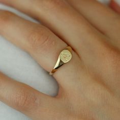 Everyone needs a signet ring in their jewelry box. This simple, chic signet ring is 14k yellow gold. Each ring has a hand engraved initial on it. Initials A-Z are available. Signet rings are classic and won't go out of style, this ring is under $500! 14k yellow gold Hand engraved Initials A-z available Please allow 4-6 weeks for production. Classic Formal Initial Ring Stamped 14k, Personalized Initial Ring In 14k Gold With Round Band, Personalized 14k Gold Initial Ring With Round Band, Minimalist Gold Initial Ring Engraved, Minimalist Gold Initial Ring With Engraving Option, Formal Tarnish-resistant Signet Ring With Round Band, Formal Tarnish Resistant Signet Ring, Formal Tarnish-resistant Signet Ring, Timeless 14k Stamped Signet Ring