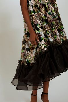 Hand-beaded floral trapeze dress with organza ruffle hem. Glamorous Organza Dress With Sequins, Glamorous Sequin Organza Dress, Glamorous Embellished Organza Dress, Elegant Embellished Tiered Skirt Dress, Prom Dresses With Ruffled Skirt And Midi Length, Prom Dresses With Ruffled Midi-length Skirt, Prom Dresses With Ruffled Midi Skirt, Prom Dresses With Ruffled Skirt In Midi Length, Party Dress With Ruffled Organza Skirt