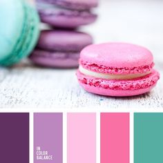 there is a pink and purple color scheme with macaroons