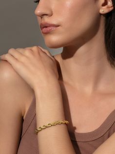 It doesn’t get much better than a classic rope chain, and our Hollis Bracelet is no exception. Created with 14k gold-plated brass, she’ll make a statement on her own but also pair well with a cuff to create a dynamic duo. | Gold Classic Rope Chain Hollis Bracelet | Women's Jewelry by Uncommon James Elegant Twisted Tarnish Resistant Jewelry, Cheap Gold Braided Bracelets, Elegant Everyday Braided Bracelet, Formal Rope Chain Jewelry, Everyday Braided Bangle Bracelet, Elegant Everyday Rope Chain Jewelry, Everyday Elegant Rope Chain Jewelry, Tarnish Resistant 14k Gold Bracelet, Tarnish Resistant Twisted Jewelry