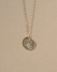 Reversible double sided Medallion charm necklace made from an old Spanish coin. A gorgeous and detailed gold necklace perfect for any occasion. Cast from an original ancient coin, the Medallion Necklace was designed to attract growth, fortune, and opportunity. Coins have a long history of bringing good luck and have be Cheap Medallion Necklace With Coin Pendant, Luxury Amulet Medallion Coin Necklace, Cheap Round Medallion Necklace With Coin Pendant, Cheap Classic Coin Pendant Jewelry, Cheap Elegant Necklace With Coin Pendant, Affordable Elegant Coin Pendant Necklace, Luxury Tarnish Resistant Amulet Coin Necklace, Affordable Bronze Coin Pendant Necklace, Luxury Elegant Coin Necklace With Large Pendant