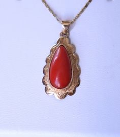 2,42gr Vintage Dutch Red Coral Pendant Yellow Gold 14k This is vintage pendant made in Netherlands from yellow gold 14k and not dyed red coral.  Beautiful piece in classic style with engraved frame. The chain is used for demonstration item only and not included into the price. Metal - gold 14k (hallmark 585 present) Dimensions of pendant: 25mm x 15mm + 5mm loop; coral size - 15x8mm Weight: 2,42gr Age: vintage Condition: please see condition on photo! Good vintage condition!   If you need more photos, write and me I'll send you. Our Viber, What's App, Telegram:  +3-8-093-91-478-91 Please visit my other listings! I have many beautiful coral jewelry posted on etsy. I ship worldwide! I provide combine shipping on this lot. Classic Red 14k Gold Necklace, Antique Engraved Red Jewelry, Red Engraved Antique Jewelry, Red Filigree 14k Gold Jewelry, Red 14k Gold Filigree Jewelry, Classic Red Hallmarked Necklace, Red Antique Engraved Necklace, Antique Red Medallion Jewelry, Antique Red Engraved Necklace