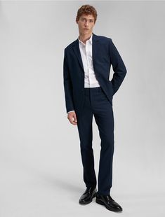 Tailored in a slim fit, these Calvin Klein suit pants are wrinkle-resistant and crafted with 4-way stretch for ease of movement. Detailed with an interior hook clasp and multiple pockets in a clean, modern silhouette. Pairs with the matching Refined Stretch Slim Fit Suit Blazer or works perfectly on its own.  Material: 66% Polyester, 31% Viscose, 3% Elastane. Modern Fitted Calvin Klein Bottoms, Tailored Calvin Klein Suits For Office, Tailored Calvin Klein Office Suit, Calvin Klein Tailored Suit For Office, Classic Calvin Klein Suits For Office, Classic Calvin Klein Office Suits, Calvin Klein Notch Lapel Suits For Workwear, Elegant Calvin Klein Suits With Notch Lapel, Calvin Klein Fitted Blazer For Formal Occasions