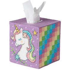 a tissue box with a unicorn on it