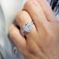 This exceptional diamond engagement features a GIA certified 3.00 Ct. Cushion cut diamond with I color grade and very clean VVS1 clarity. Matching its color and clarity are 0.70 Ct. Round cut diamonds set pave on the halo and flow down the shank in a single row. Matching Band is available by request! Metal : 14K Gold, 18K Gold or Platinum Setting Type : Prong, U-Setting Total Carat Weight : 3.70 Carats Type : Natural Diamond Shape : Cushion Cut Carat Weight : 3.00 Ct. (GIA Certified) GIA Certifi Lab Grown Diamond Radiant Brilliant Cut Wedding Ring, Gia Certified Lab-grown Diamond Promise Ring, Gia Certified Moissanite Diamond Ring For Proposal, Gia Certified Diamond White Diamond Ring For Proposal, Cushion Cut Lab Grown Diamond In White Gold, Lab Grown Diamond Ring With Radiant Cut, Luxury Gia Certified Diamond White Diamond Ring, White Cubic Zirconia Radiant Cut Ring, Gia Certified Moissanite Halo Ring For Promise