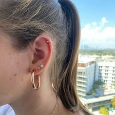 These beautiful light-weight hoops arethe perfect transitional day to night piece. Available in 14K White Gold, Yellow Gold, or Rose Gold Earrings are hollow Exterior Diameter = 35mm Interior Diameter = 30mm Thickness = 4mm Stephanie Gottlieb, Tube Hoop Earrings, Flower Band, Rainbow Gemstones, Gold Bead Bracelets, Jennifer Fisher, Initial Ring, Star Bracelet, Diamond Flower