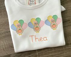 Gobble gobble!  This sweet Thanksgiving turkey shirt can be personalized with your child's name or initials. Design is sketch style embroidery, embroidered onto a 100% cotton shirt or bodysuit.  Available in long or short sleeve.  Soft fabric backing is attached to the back of the design to be gentle on skin.  All shirts are white unless otherwise noted or requested.  When selecting a size please note that because the fabric is 100% cotton some shrinkage is expected.    Note: Please be cautious about where your child wears the shirt with their name to ensure their safety around strangers. If you prefer not to have your child's name on the shirt, we can also do a monogram, nickname, or phrase. For any questions, please contact us. Please include child's name to be embroidered in message sec Thanksgiving Shirts Embroidery, Stuffed Turkey Shirt, Little Turkey Shirt, Personalized Pumpkins, Turkey Applique, Girls Thanksgiving, Turkey Shirts, Gobble Gobble, Applique Shirts