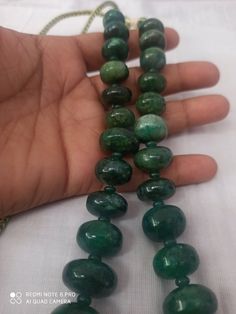 17 '' AAA 922 Caret Emerald Beryl Smooth Rondelle 13- 25MM Beads Gemstone Necklace with adjustable code Stone : Emerald Beryl Shape :- Rondelle Necklace - 17 inch 1 line string Size :- 13mm to 25mm Weight :- 922 carat Quality - AAA Polish :- Handmade color - green makes a great gift for your loved ones. It is known as the 'love stone' as the message it emits is the strong vibration of unconditional love, joy, warmth and healing. As quartz crystals are profound amplifiers of energy, it may help t Rondelle Necklace, Pumpkin Bead, Carnelian Bracelet, Gem Shop, 108 Bead, Quartz Crystals, Little Flowers, Natural Emerald, Moon Stone