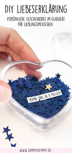 a person holding a spoon in their hand over a blue bag with stars on it