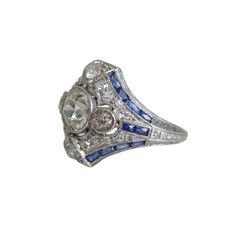 The detailing on this ring is nothing short of spellbinding. The ring itself is a work of art, with ornate engravings that seem to tell a story of romance, as if it were a cherished heirloom passed down through generations of royalty. Wearing this ring feels like stepping into a fairy tale where every glance at its shimmering sapphires and diamonds transports you to another time. Please allow 1-2 weeks for delivery. Fairy Tales, Art