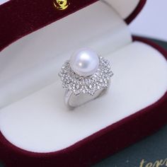 Get dressed up with our 10-11mm Freshwater Pearl & Round Cubic Zirconia. It has the perfect combination of elegance and style. The freshwater pearl creates a timeless look that makes this piece an ideal choice for any outfit. The round cut Cubic Zirconia add just the right amount of sparkle and shine to the overall design. This ring is perfect for special occasions or everyday wear, so you can show off your glamourous side no matter where you go. 10-11mm Freshwater Pearl Earrings This popular ea Button Pearl Earrings, Baroque Pearls Necklace, Popular Earrings, Pearl Rings, Baroque Pearl Earrings, Purple Pearl, Gold Pearl Necklace, Gold Pearl Earrings, White Freshwater Pearl