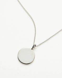 Engravable Round Necklace | Sterling Silver. Make It Personal with a Necklace. Paired with a Delicate Chain, the Smooth Clip-On Pendant Can be Engraved on Both Sides – the Perfect Gift for that Special Someone. Opt for the Engravable Round Disc Pendant. Please Note: Engraving Items May Take 7-10 Working Days to Process. Pendant Metal: Sterling Silver Pendant Dimensions: 15mm Short Plain Chain: Total Length 450mm with Extension Links at 410mm, 430mm and 450mm Weight: 4. 3 Gproduct Code: En-S-N1-N Classic Silver Necklace With Large Pendant, Classic Silver Initial Pendant Chain Necklace, Classic Silver Chain Necklace With Initial Pendant, Sterling Silver Coin Pendant Jewelry, White Gold Charm Necklace With Cable Chain, Sterling Silver Necklace With Round Cable Chain Pendant, Classic White Gold Necklace With Large Pendant, Classic Silver Pendant Medallion Necklace, Classic Silver Medallion Pendant Necklace