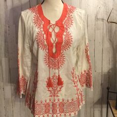 Size Medium Petite. Never Worn Or Washed. Lots Of Embroidered Details Throughout. Color Is Coral Orange Long Sleeve Blouse With Floral Embroidery, Long Sleeve Orange Top With Floral Embroidery, Orange Floral Embroidered Long Sleeve Top, Orange Blouse With Floral Embroidery, Summer Embroidered Orange Blouse, Orange Embroidered Summer Blouse, Spring Embroidered Orange Blouse, Summer Orange Embroidered Blouse, Embroidered Orange V-neck Tops