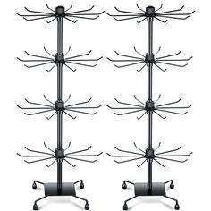 three black metal racks with wheels on them