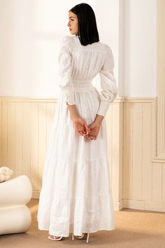 FINAL SALE! NO RETURNS. NO EXCHANGES. Georgia Maxi Dress will make a lasting impression at your next spring event! With an elastic waist, long sleeves, and tiered peasant skirt. LENGTH: 52" from top of shoulder FABRICATION: 100% White Linen STYLE#;DR-21450 White Linen - WHITE-S24 *Dry Clean or wash on cold and hang flat to dry *Model is wearing size XS White Dress Modest, Modest Winter Dresses, White Country Dress, Long Sleeve White Maxi Dress, Modest White Dress, White Peasant Dress, White Linen Maxi Dress, Classy White Dress, Linen Gown