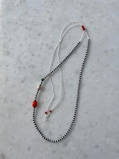 ☯︎ This tiny, adjustable necklace is a charming piece you'll want to wear every day. Featuring the soothing green of jade, the vibrant touch of coral, and a single elegant pearl, it's a perfect blend of beauty and tranquility. The minimalist design makes it a versatile accessory that adds a lovely, heartfelt touch to any outfit. Whether you're at work or enjoying a casual day out, this necklace is a delightful reminder to embrace the simple joys of life. Materials: ☯︎ Miyuki Beads ☯︎ Jade  ☯︎ Coral ☯︎ Real Pearl ☯︎ Adjustable and Durable Rope 🐉 Jade is your go-to stone for peace and balance. It's like a little lucky charm that helps attract good fortune and harmony. Perfect for when you want to feel calm and centered throughout your day! 🪸 Coral brings the energy of the ocean right to yo Adjustable Necklace With Sliding Knot For Gifting, White Adjustable Jewelry For Gift, White Adjustable Jewelry As A Gift, White Minimalist Beaded Gemstone Necklace, Minimalist White Gemstone Beaded Necklaces, Adjustable White Beaded Lariat Necklace, White Adjustable Lariat Beaded Necklace, White Adjustable Jewelry As Gift, Gift Round Pendant Necklace With Sliding Knot