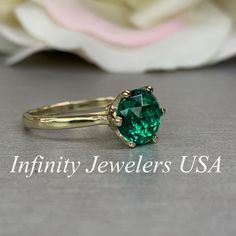 "The ring pictured is lab created emerald #5837 Also Shown in 14k White Gold -Approximate total carat weight: approx. 1.90ctw diamond equivalent -Center Stone Size: 8mm - approx. 1.90ct diamond equivalent -Center Stone Shape: round / rose cut -Gem Type: lab created emerald -Stone Clarity: VS2 -Stone Color: Green -Moh's Scale: 8x.5 hardness -Metal Type and Purity: 14k yellow gold -Setting: 6 prong crown head -Stock Ring Size: 6 -Country of Manufacturing: USA (Michigan) For customization please co 14k Gold Emerald-cut Birthstone Ring With Diamond Cut, 14k Gold Emerald Ring For Proposal, 14k Gold Emerald Cut Diamond Birthstone Ring, Elegant 14k Gold Emerald Ring For Proposal, 14k Gold Birthstone Ring With Emerald Cut Diamond, Green 14k Gold Promise Ring, Classic Emerald Diamond Promise Ring, Classic Solitaire Diamond Ring For May Birthstone, Elegant 14k Stamped Emerald Ring