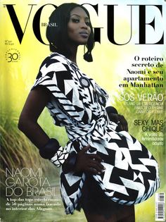 a woman in a dress on the cover of a magazine, with her hands on her hips