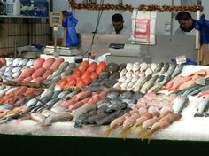 fish are on display at an outdoor market