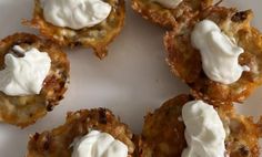 small appetizers with whipped cream are on a white plate