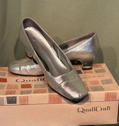 This is a vintage pair of women's heels from the 1960s. They are marked QualtiCraft & marked a size 5-1/2. Made of silver lame' with clear acrylic heels. They have 2" chunky  heels & closed, squared toes. The soles are manmade & the heels capped with rubber. The inner soles measures 9-1/4" long on the inside & are 2-7/8" wide across the ball of the foot on the outside of the sole. Marked a size 5 -1/2. The shoes are in very good, vintage condition. The shoes show wear to the soles. Inner soles are beginning to curl. Please see photos for details. Charming! Retro Court Shoes With 4-inch Heel For Party, Retro Fitted Low Heel Shoes, Retro Fitted Low Heel, Fitted Retro Low Heel, Retro Heels With 4-inch Heel And Medium Width, Retro 4-inch Heel Heels With Medium Width, Retro Almond Toe Heels With 4-inch Heel, Retro Heels With Pointed Toe Medium Width, Retro Fitted Almond Toe Court Shoes