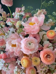 a bunch of flowers that are sitting on a table