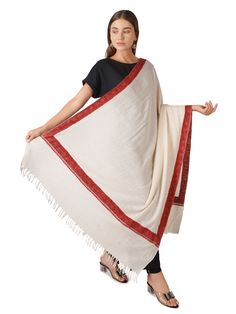 Enhance your wardrobe with the timeless elegance of our Pashmina Shawl featuring exquisite border embroidery. Crafted from luxurious Kashmiri pashmina, this shawl offers both warmth and sophistication, making it an ideal accessory for any occasion. Product Details: Hand Embroidered Pure Kashmiri Pashmina Material: Pure Kashmiri Pashmina (100% Cashmere) Color: Off White Size: 100 cm X 203 cm / 40 Inch X 80 Inch / 1.1 x 2.2 Yards (Approx) Embroidery: Intricate border embroidery in contrasting hues Sourced From: Changthangi goats in the Himalayan region of Ladakh Origin: Handcrafted in Kashmir by skilled artisans Description: Wrap yourself in luxury with our Pashmina Shawl adorned with delicate border embroidery. The soft and breathable Kashmiri pashmina fabric ensures comfort throughout the White Pashmina, Border Embroidery, Cashmere Color, Wool Wrap, Pashmina Shawl, Elegant Accessories, Cashmere Scarf, Hand Embroidered, Timeless Elegance