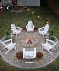 a fire pit with chairs around it