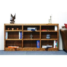 a wooden bookcase with many books on it