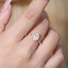 a close up of a person's hand with a ring on it