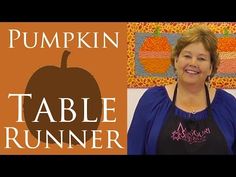 a woman standing in front of a pumpkin table runner with the words pumpkin table runner on it