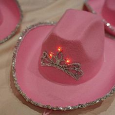 Light-Up Pink Cowgirl Hat with Sequin Lights up in different colors Made of felt pink-colored material Tiara glued in middle Each item may have small flaws due to handmade nature Shipping and Additional Info: Processing time: 0-3 weeks (due to international delays, may take longer) Tracking info emailed once product has shipped International buyers responsible for customs duties and VAT fees Not responsible for damages or lost packages after shipping No returns or refunds, all sales final Colors Pink Wide Brim Mini Hat For Festival, Fun Pink Hats For Country Events, Fun Pink Hat For Country Events, Pink Brimmed Hats For Country Events, Pink Wide Brim Costume Hat For Festival, Adjustable Felt Hat For Party, Adjustable Felt Party Hat, Adjustable Felt Hat For Parties, Pink Mini Hat For Festivals