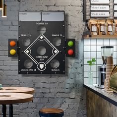 a game board mounted to the side of a wall next to a table with stools