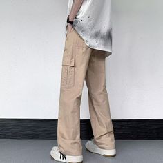 Our Casual Literary Straight Cargo Pants are an essential piece for any stylish look. Boasting a sophisticated solid color and deep pocket detail, these premium pants are the perfect balance of casual and literary. Ideal for any occasion, you'll feel both comfortable and confident in these urban-chic trousers. Features: -100% Cotton -Mid-rise waist -Solid Color -Straight Leg -Regular Fit -Casual style Relaxed Fit Solid Dress Pants With Side Pockets, Spring Parachute Pants With Patch Pockets, Streetwear Trousers With Welt Pockets, Spring Full Length Cargo Pants With Hip Pockets, Wide Leg Work Pants With Welt Pockets For Streetwear, Wide-leg Cotton Pants With Multiple Pockets, Urban Spring Bottoms With Patch Pockets, Cotton Wide-leg Pants With Multiple Pockets, Straight Leg Chinos With Cargo Pockets For Streetwear