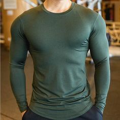 Long Sleeve Quick Dry Men’s Sports & Workout T Shirt Functional Green Tops For Sports Events, Solid Color Crew Neck Activewear For Sports Events, Solid Crew Neck Activewear For Sports Events, Long Sleeve Stretch T-shirt For Gym, Green Athletic Fit T-shirt For Workout, Green Crew Neck Activewear For Sports, High Stretch Long Sleeve T-shirt For Gym, Green Crew Neck Sportswear Activewear, Green Stretch T-shirt For Sports