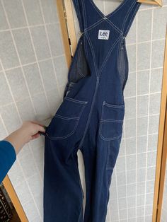 "1970's blue denim Lee's bib overalls Size XS waist: 25\" hips: 34\" inseam: 30\"" Blue Denim Overalls With Button Closure, Retro Denim Blue Overalls, Vintage Denim Blue Overalls, Vintage Denim Blue Bib Front Overalls, Vintage Dark Wash Bib Front Overalls, Bib Overalls, Raggedy Ann, 1970s, Blue Denim