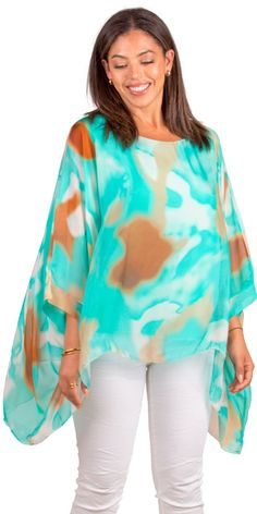 100% Silk Kaftan Style Blouse with Colorful Aura Print. Features 3/4 Length Sleeves and a Wavy Bottom. Exterior: 100% Silk Interior: 95% Viscose, 5% Elastic Fits Sizes XS- XL Made in Italy Multicolor Half Sleeve Tops For Beach, Green Half Sleeve Tops For The Beach, Bohemian Half Sleeve Blouse For Vacation, Green Half Sleeve Tops For Vacation, Green Half-sleeve Top For Vacation, Green Half Sleeve Top For Vacation, Bohemian Half Sleeve Blouse For Beach, Bohemian Half Sleeve Beach Blouse, Multicolor 3/4 Sleeve Top For Vacation